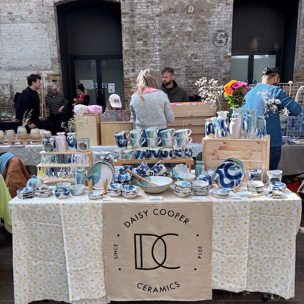 Market stall tablecloth printed with a maker's logo by Moorside Studio — bold artisan signage for craft market traders