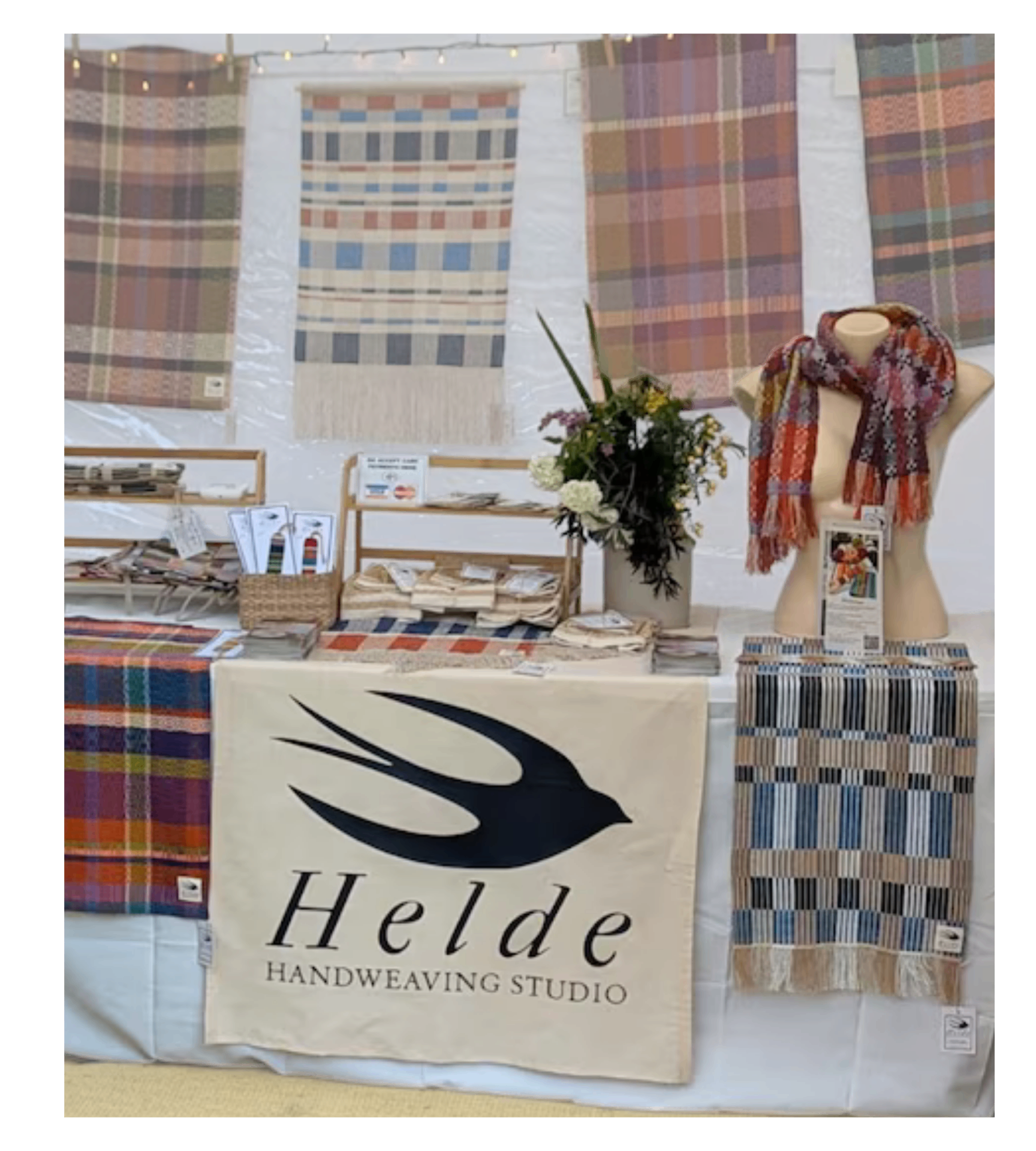Helde Handweaving Studio market stall — bespoke linen branding, hand-woven scarves, throws and styled artisan product display by Moorside Studio